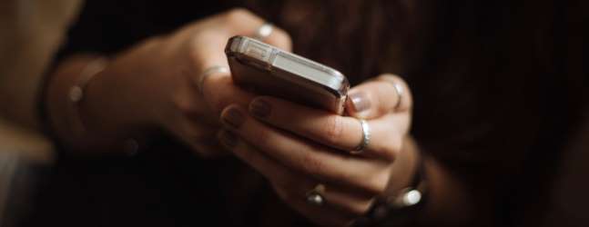 Close up of someone's hands using a smartphone